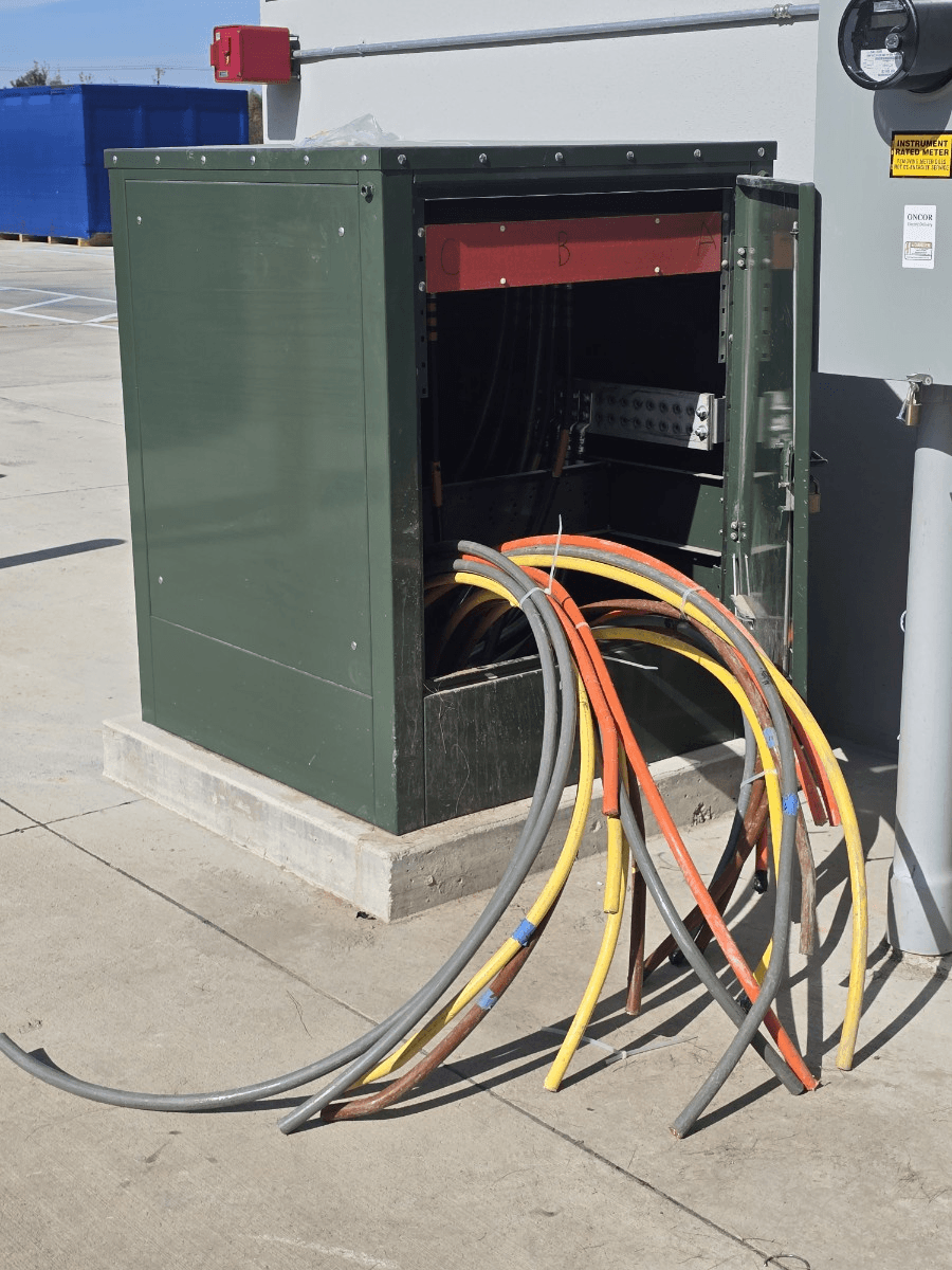 Service entrance conduit installation at industrial manufacturing facility